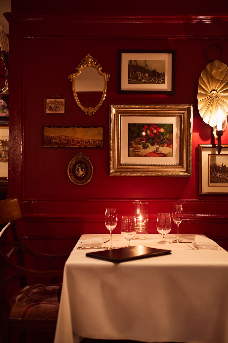 Empty dining tables in a the wine room at The Immigrant Restaurant