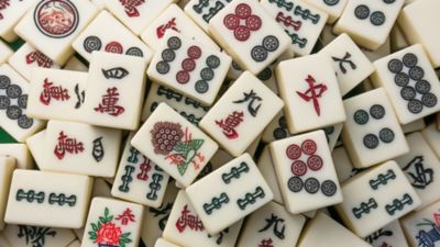 Mahjong pieces spread out on a table