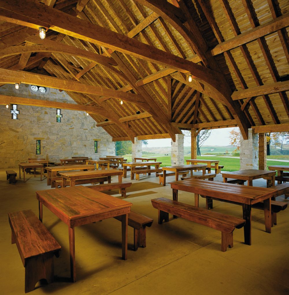 Tables in the Irish Barn without place settings. 