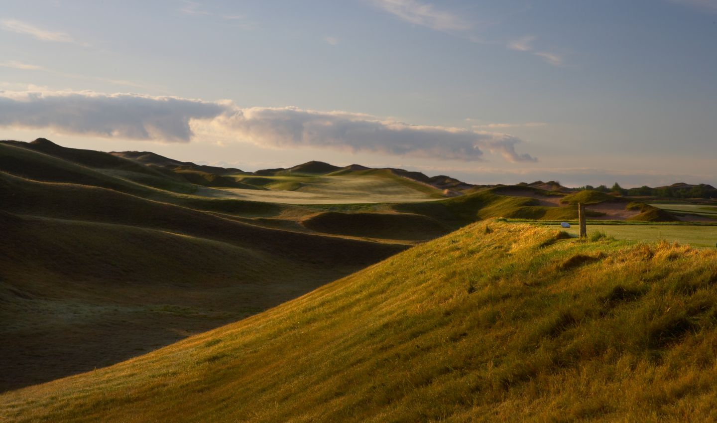 The first hole on the Irish Course shows a view of the green and flags stick from the tee off.