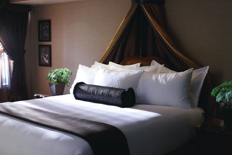 A bed in a governor suite