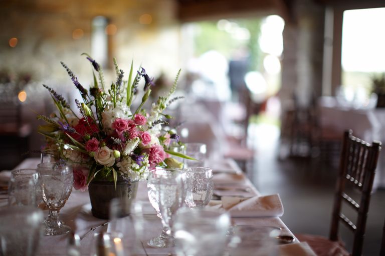 A table setting with a vibrant floral centerpiece. 