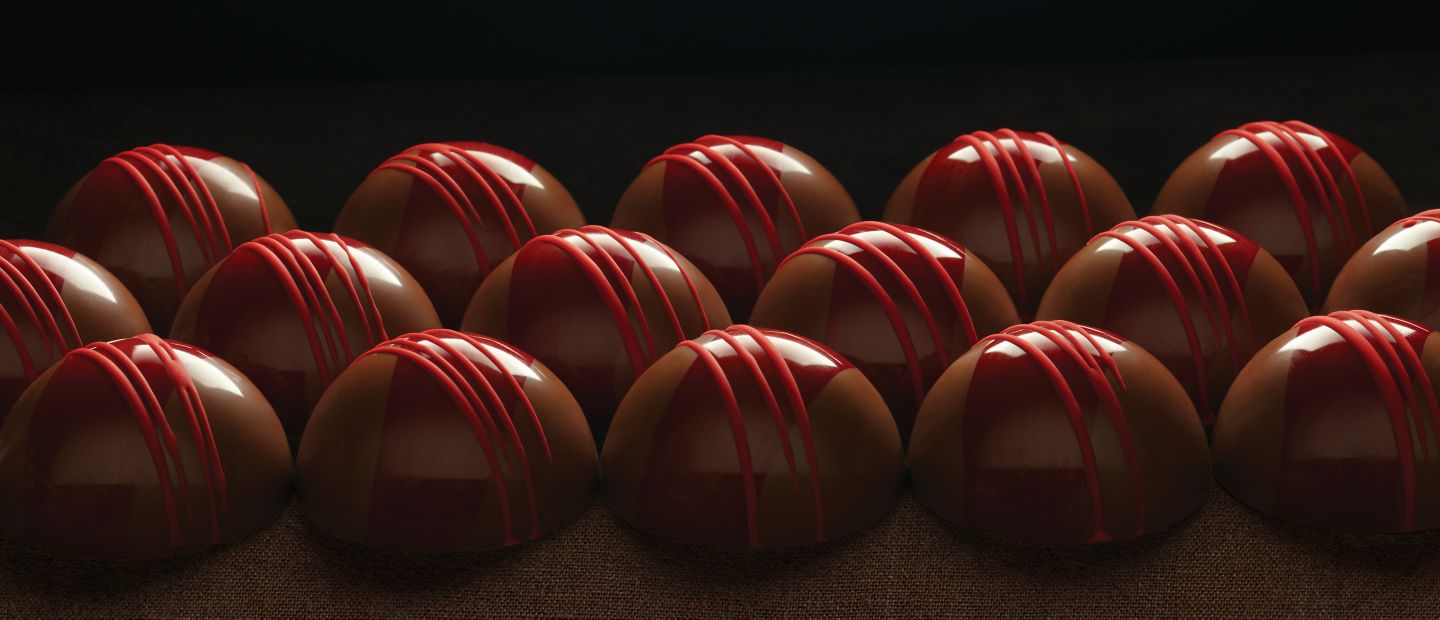 Kohler Chocolates lined up on a dark background