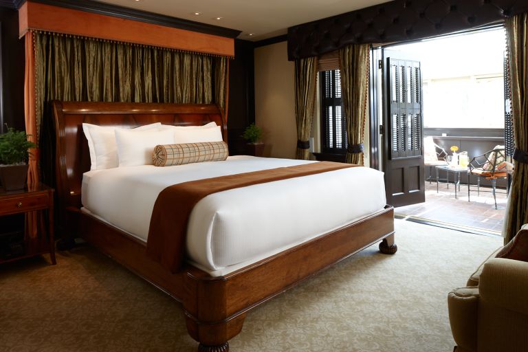 a king bed in a carriage house suite