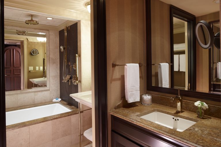 a bathroom in a deluxe room at the carriage house