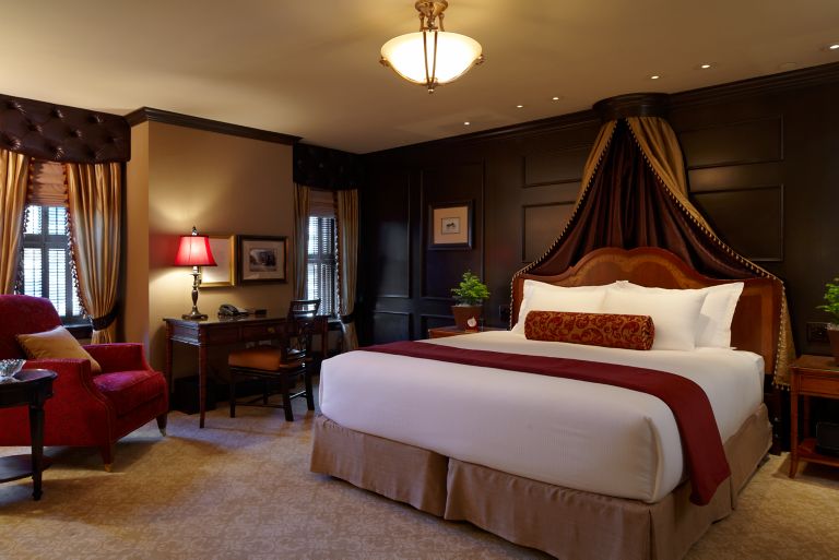 a bed with a headboard canopy