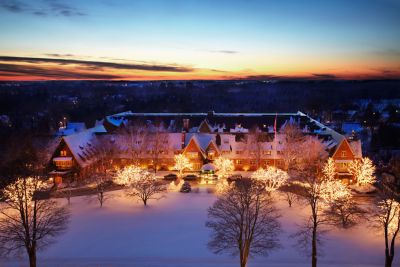 The American Club exterior with twinkling lights and snow