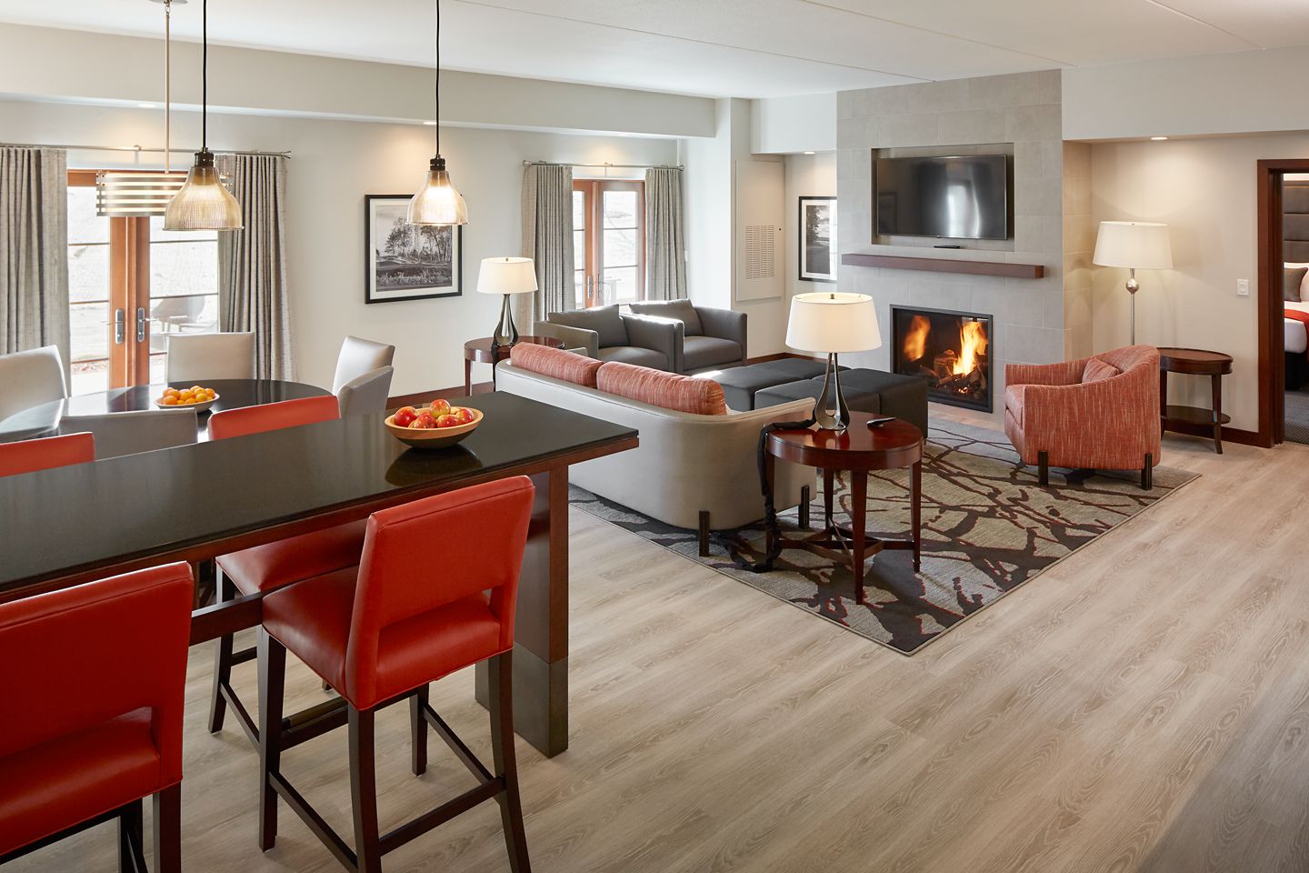 The interior of a suite at the Inn on Woodlake featuring a fireplace and a seating area