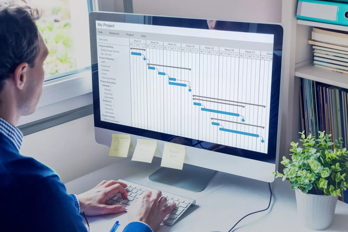 Person sitting at a desk with a scheduling application open