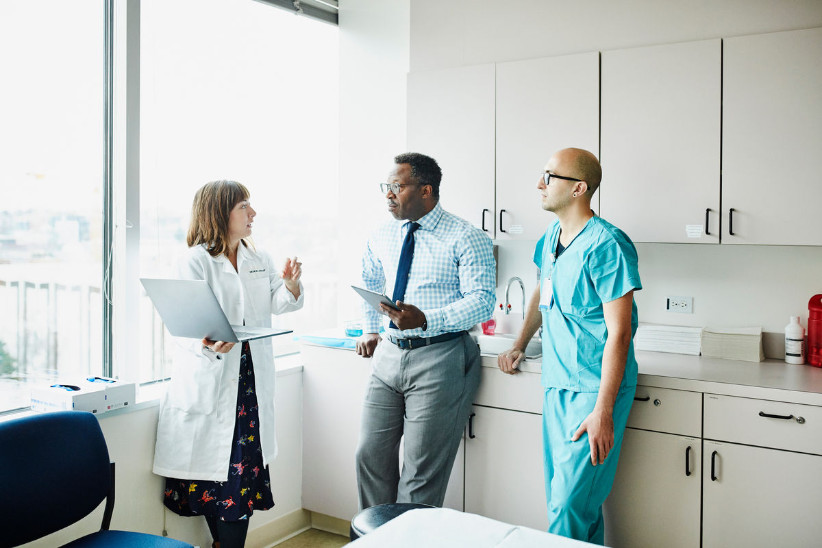 Group of doctors converging in a corridor