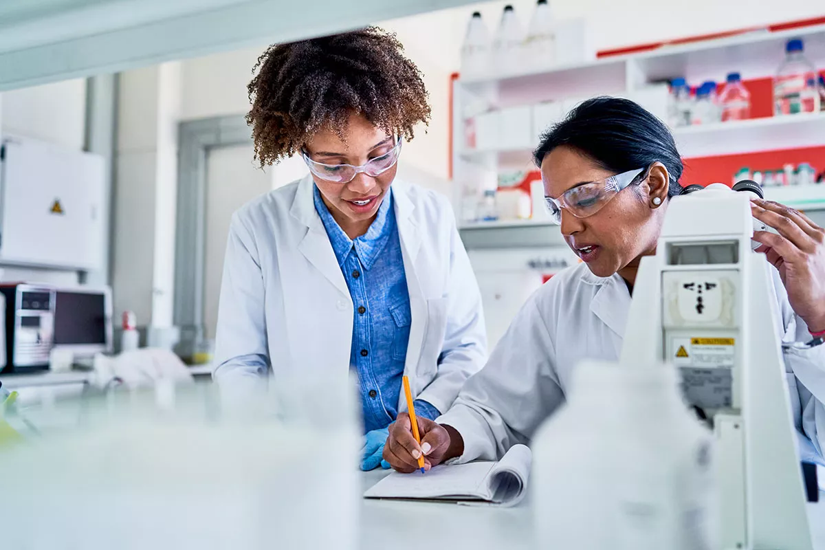 Two scientists working inside a lab 