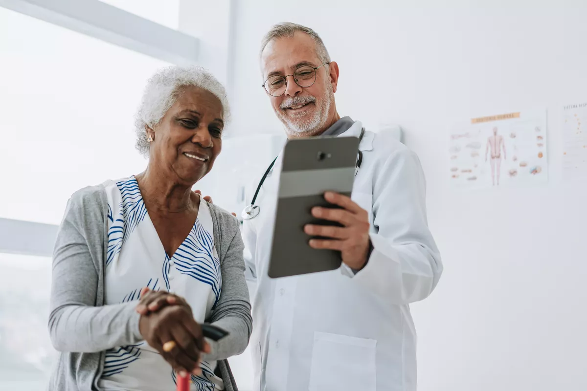 Provider presenting his patient results on a tablet