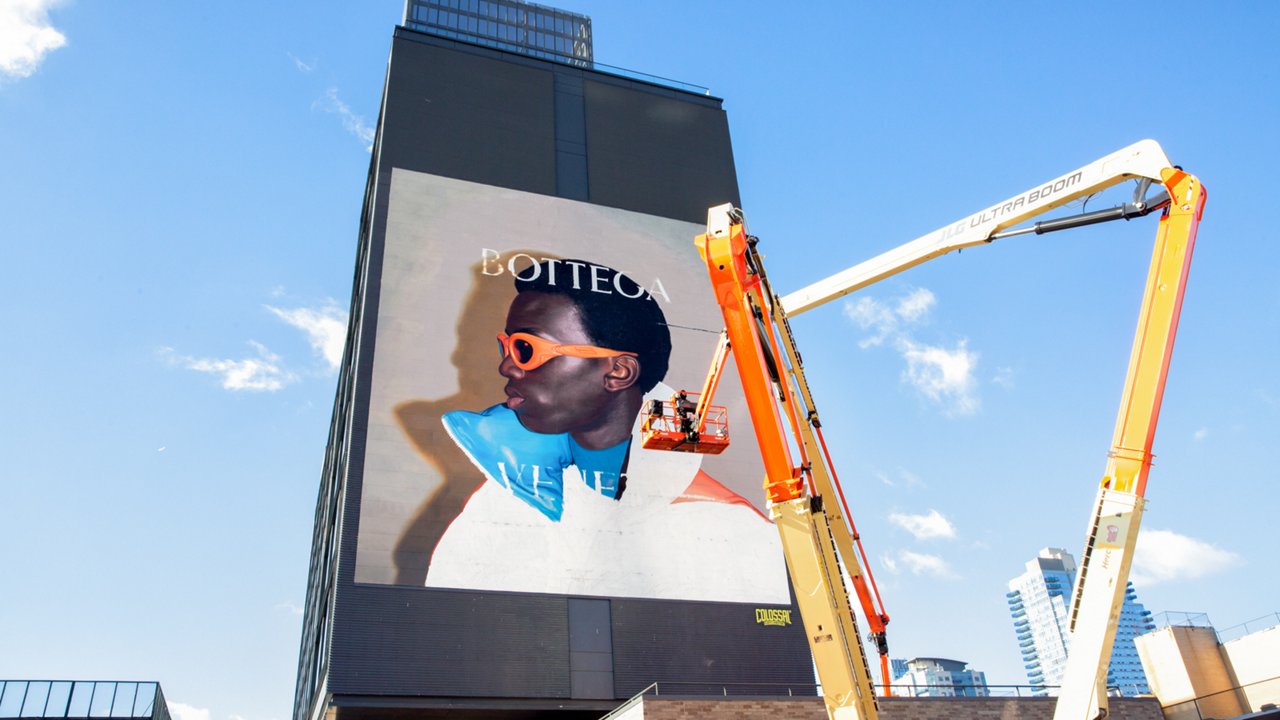 Colossal Media handpainting a wall