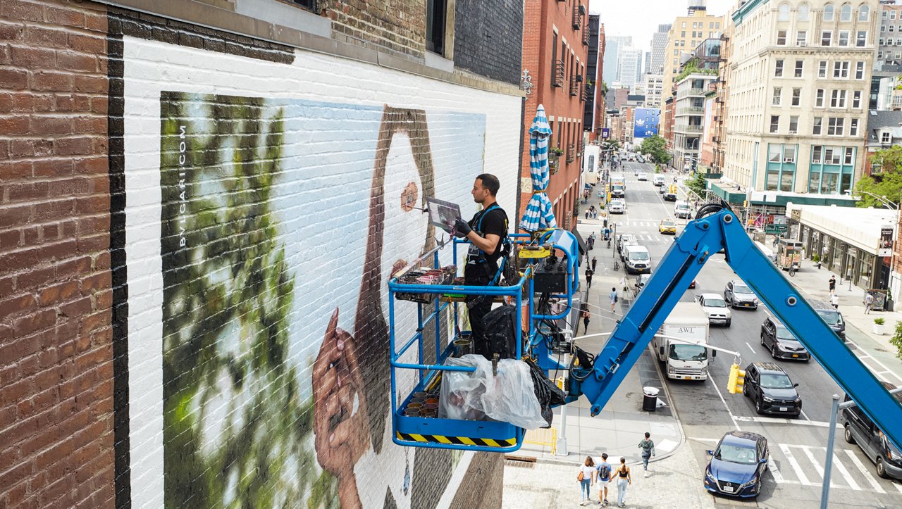 Colossal Media handpainting a wall