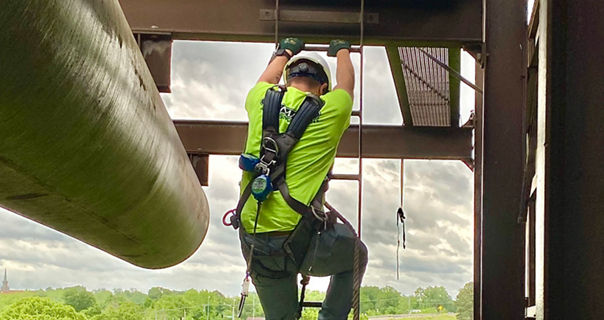 Lamar Advertising billboard installation employee descending billboard structure