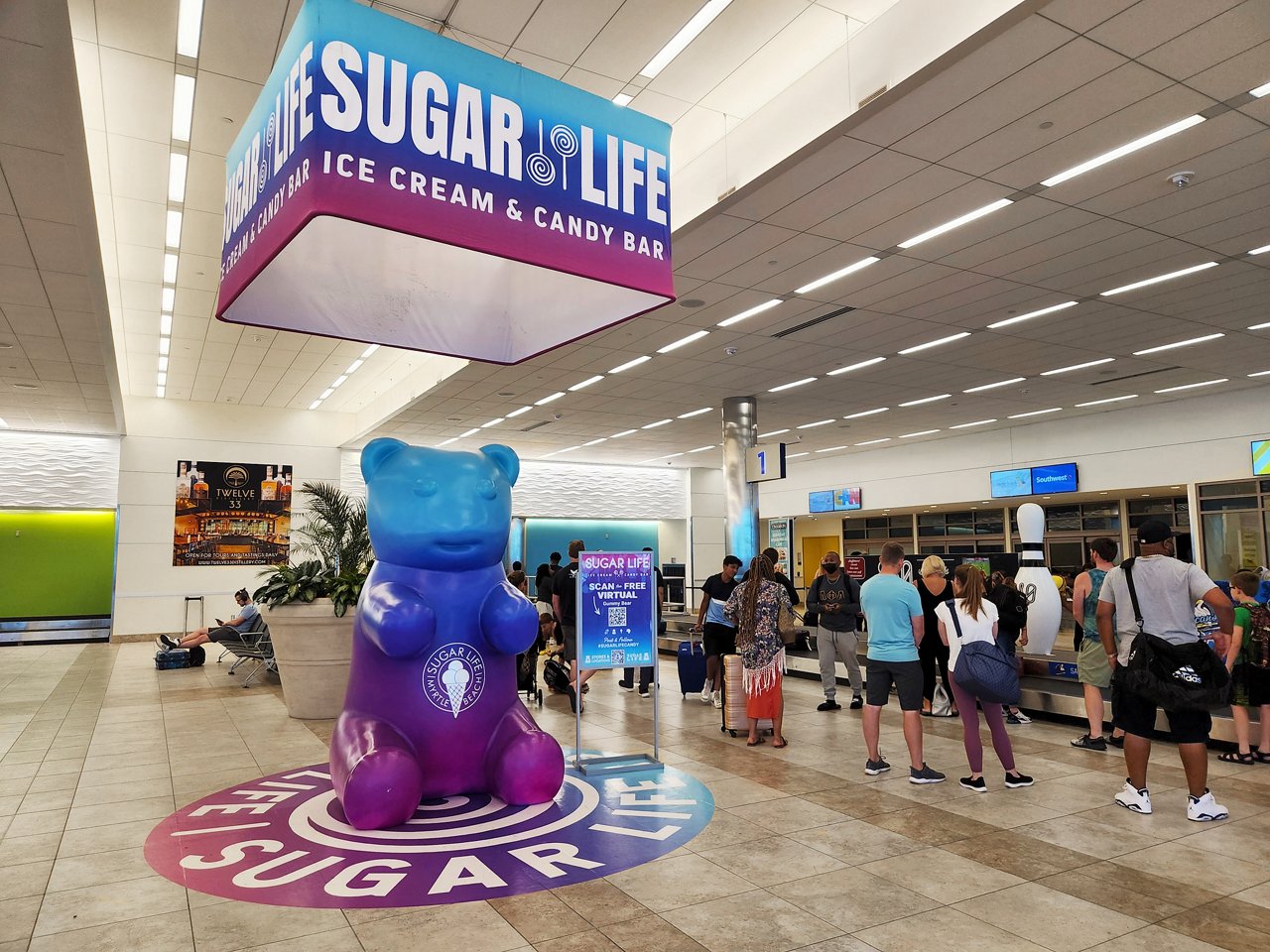 Lamar Advertising and Sugar Life baggage claim custom display in Monterey Airport 
