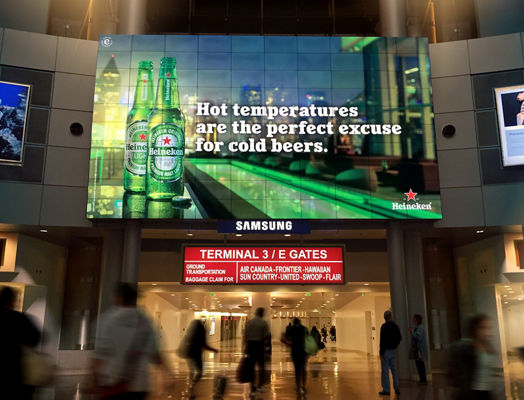 Lamar digital airport advertising display for Heineken beer
