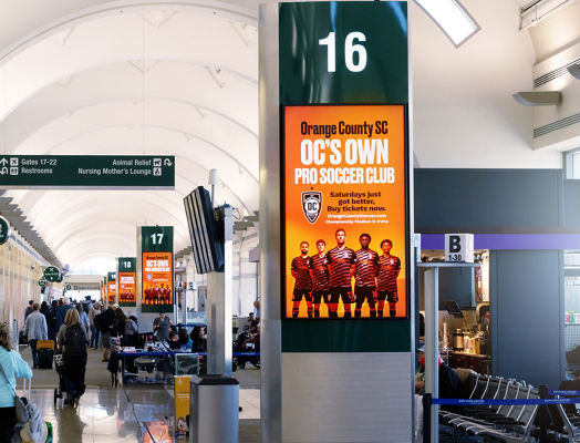 Lamar Advertising and Orange County Soccer Club concourse digital network at Orange County Airport