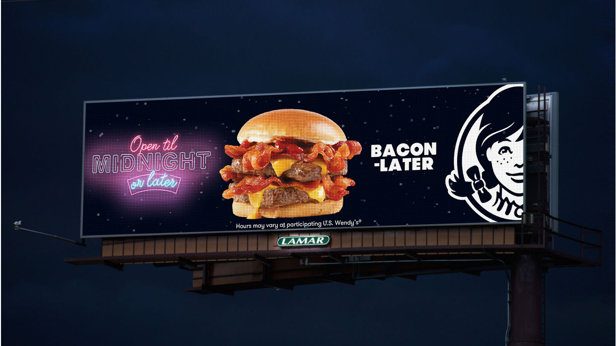 Wendy's ad on a Lamar Digital Billboard at night