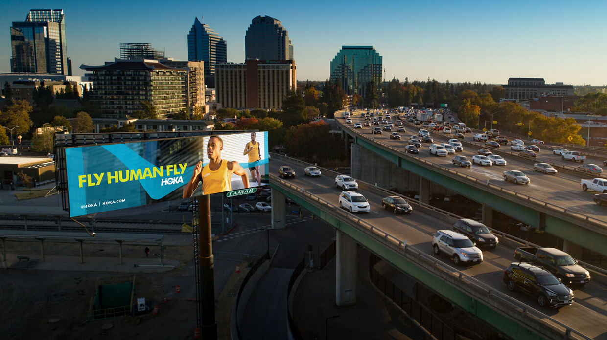 Lamar Advertising Hoka Digital Billboard "Fly Human Fly"