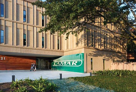 Lamar Advertising Corporate Headquarters green Lamar sign at entrance to building