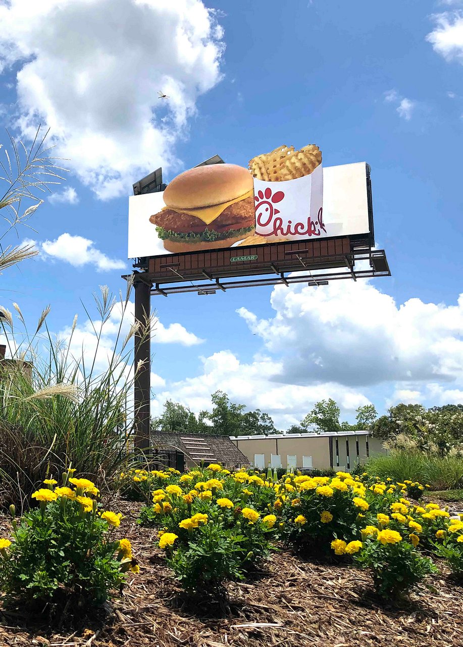 Chick-Fil-A advertisement on Lamar billboard