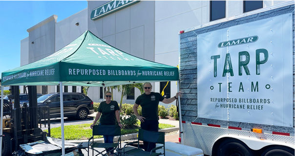 Lamar advertising's Tarp Team handing out repurposed tarp for hurricane relief