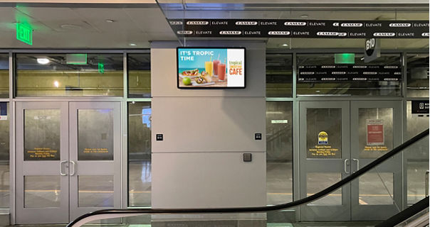 Digital airport gate advertisement for Tropical Smoothie Cafe in Denver airport on Lamar Advertising inventory