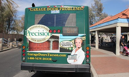 Precision overhead garage door service advertisement on the back of a bus in Tucson on Lamar Advertising inventory 