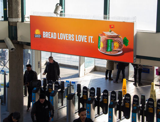 Lamar digital billboard in Vancouver Airport for Country Harvest Bread