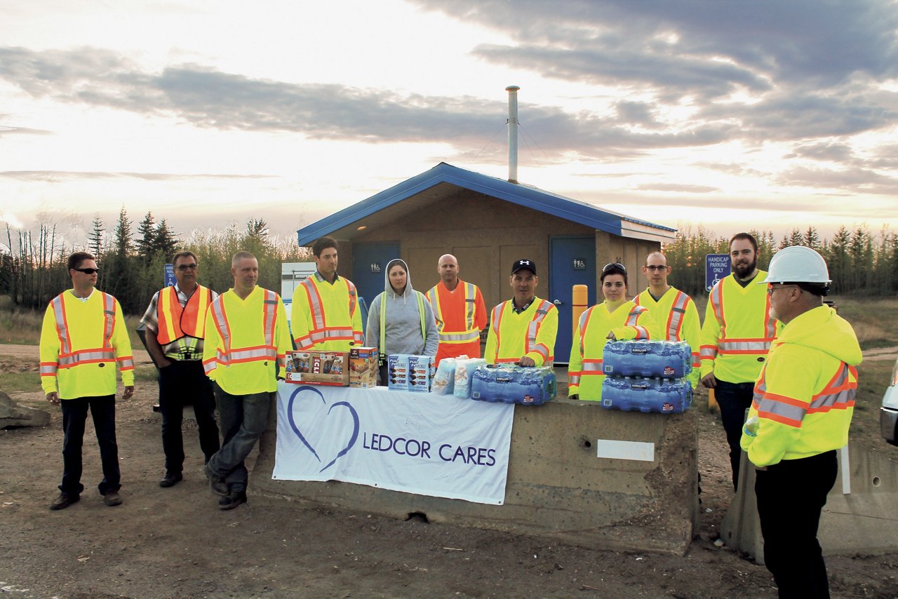 Employees in Fort McMurray, Alberta, offering water and assistance to those impacted by wildfires