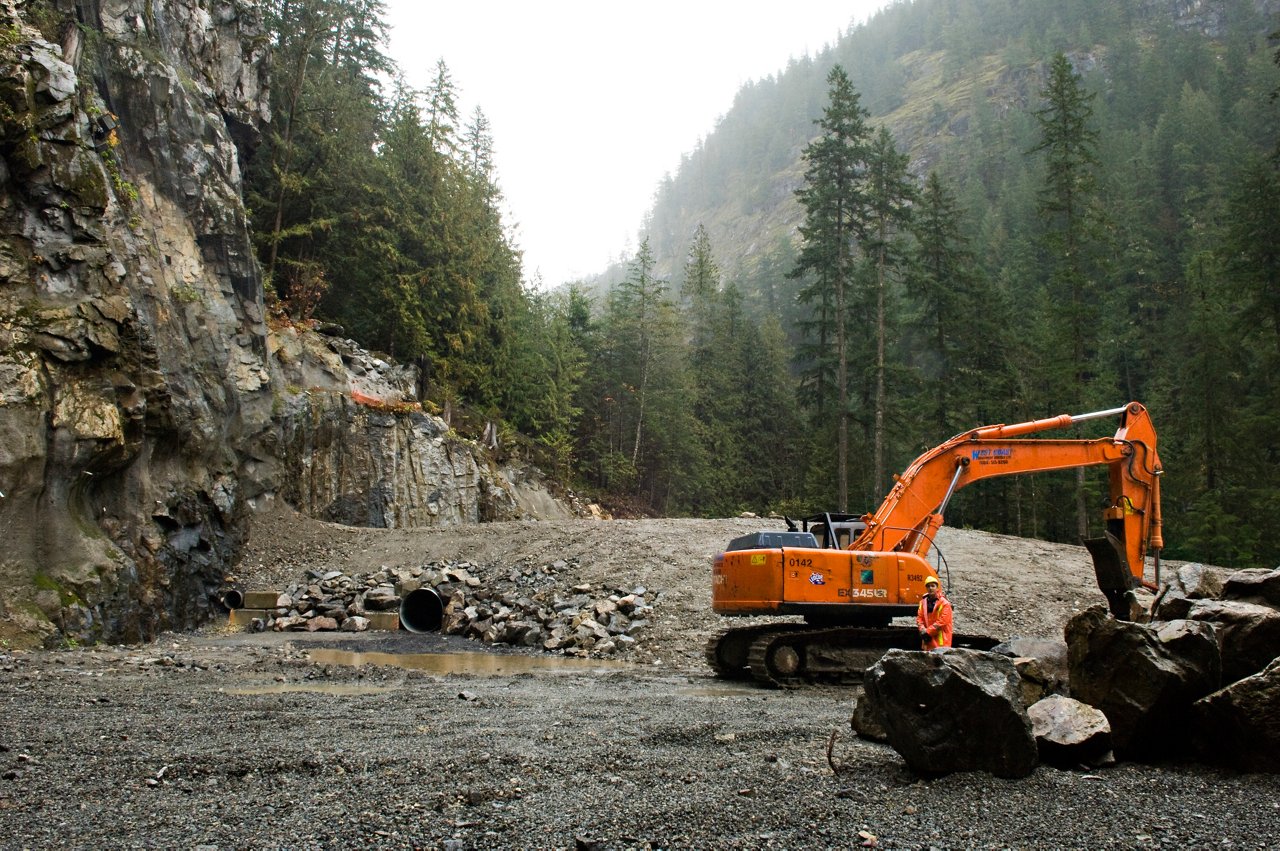 An excavator clearing the site.
