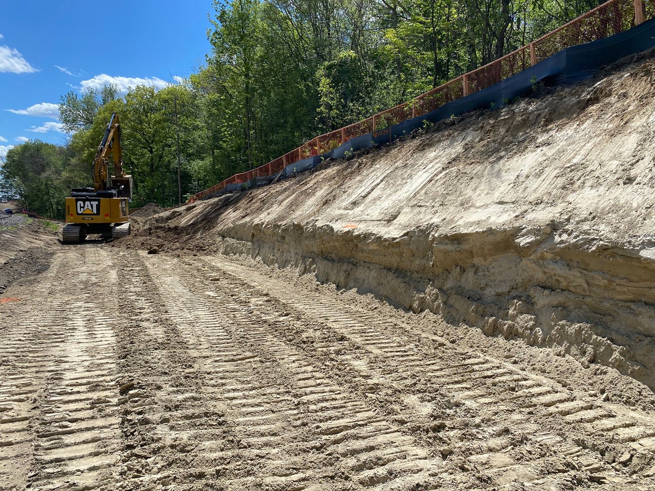 Excavator clearing the road.