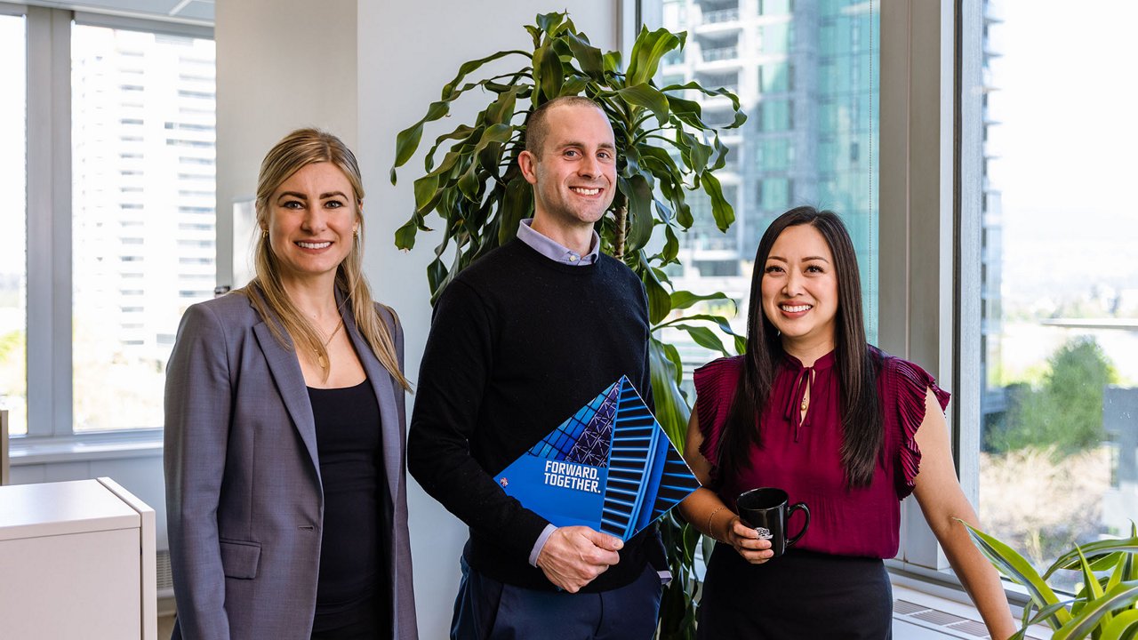 Three Ledcor employees posing for the camera