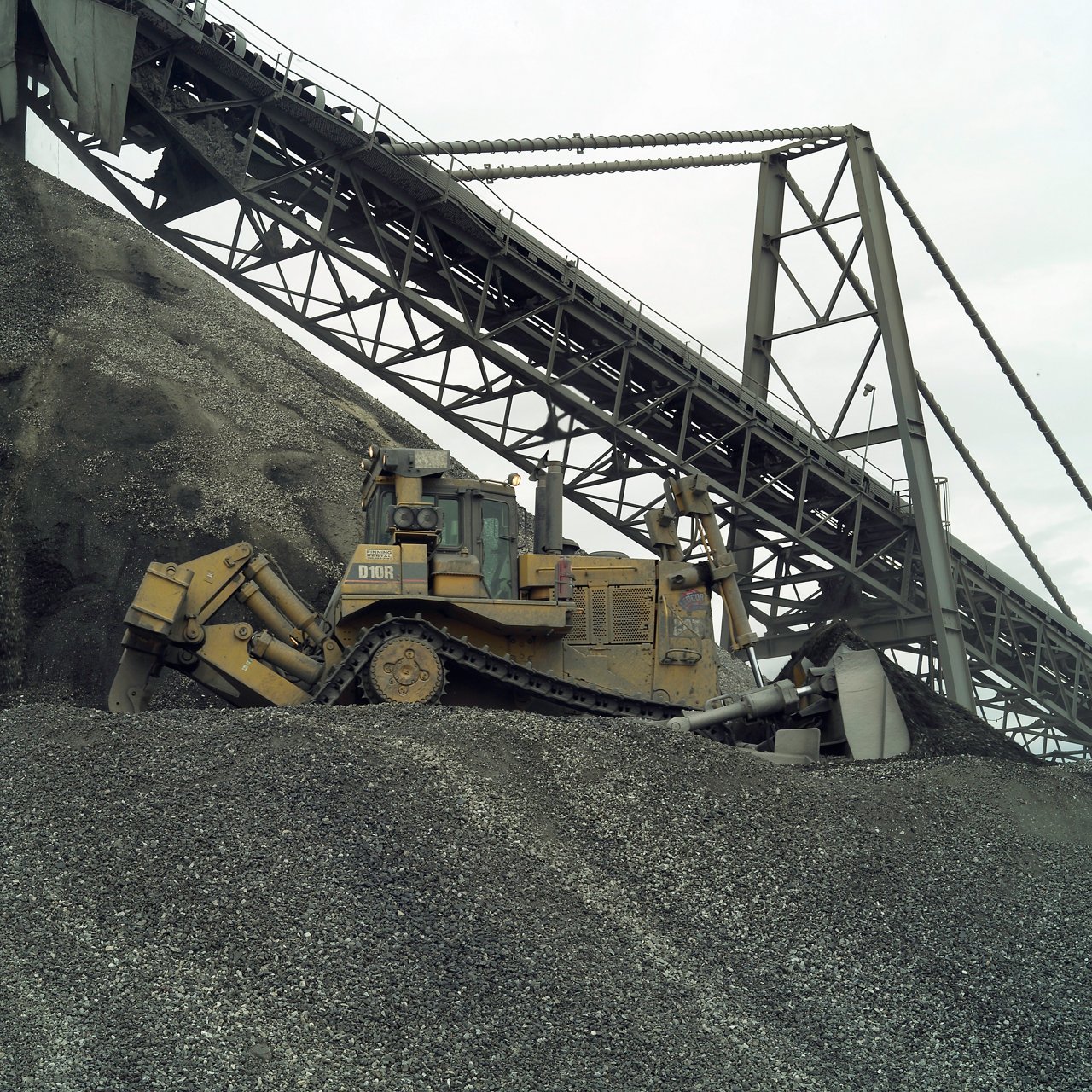 Bulldozer with mining equipment on site.