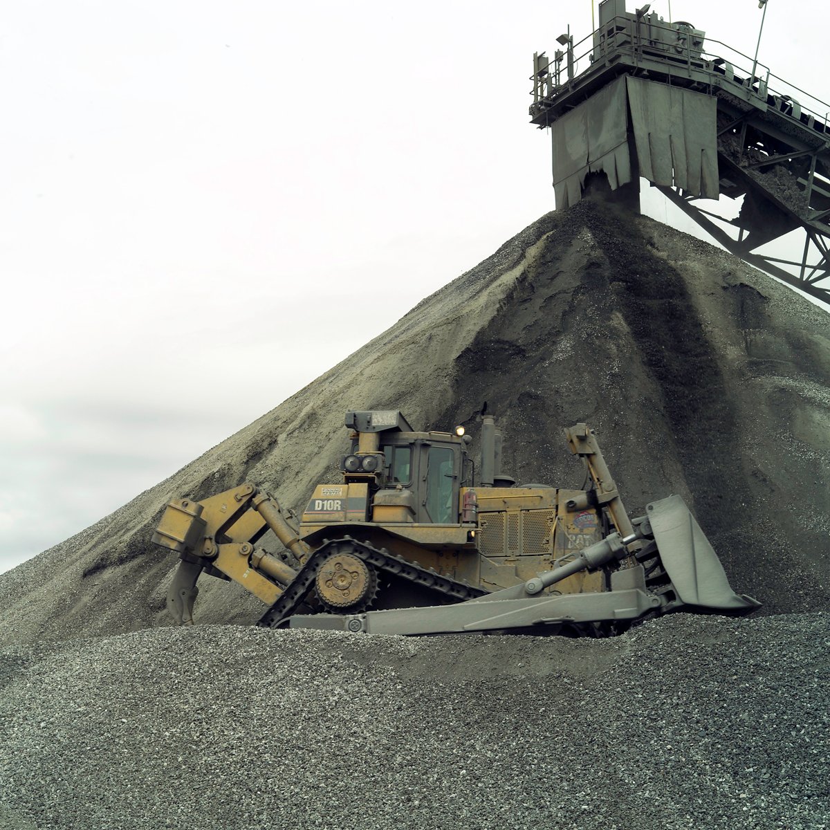 Bulldozer with mining equipment on site.