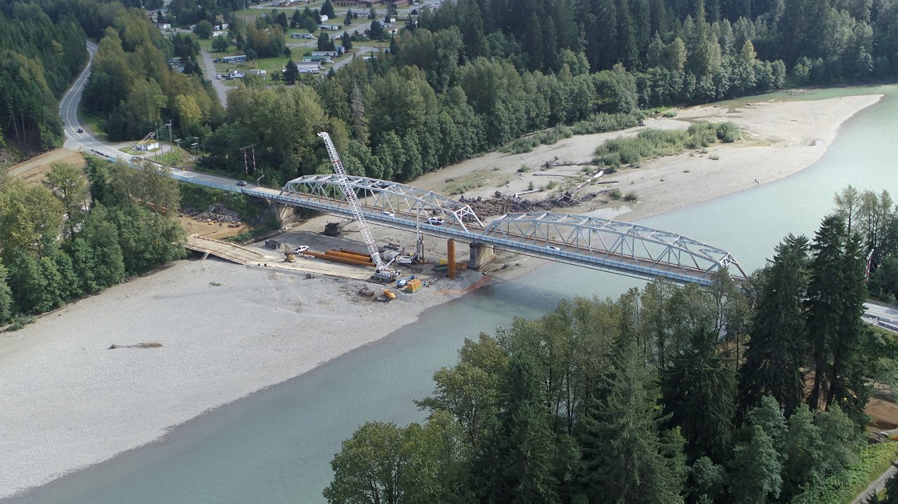 skyshot of bridge being built over river
