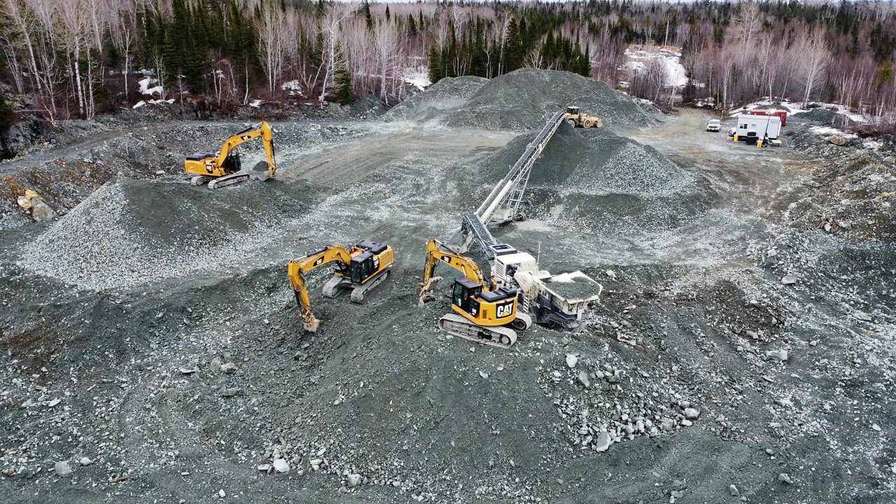 Excavator dumping the soil. 