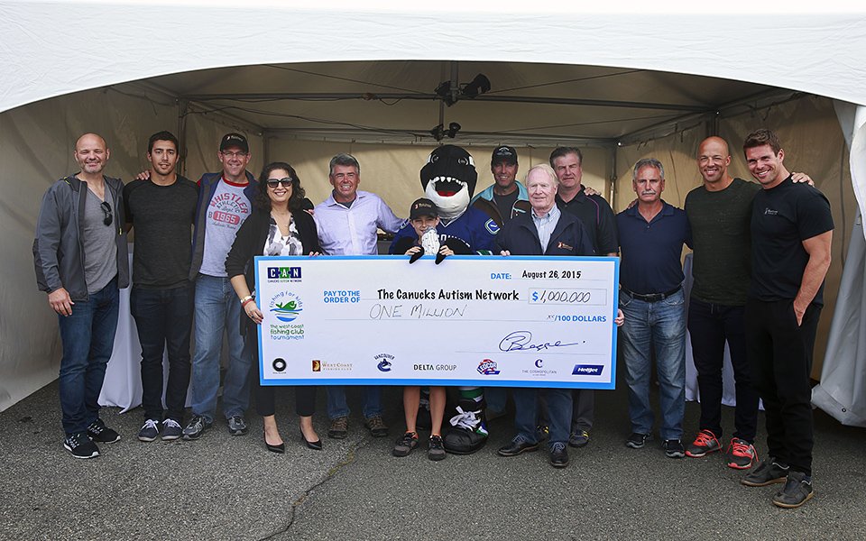 Ledcor's Champion Child is photographed with those involved in the Fishing for Kids Tournament. 
