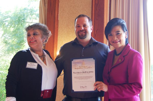 Ledcor's Nathan DiFilippo poses with MERCI's Executive Director Marta Escanuelas and Congresswoman Judy Chu, 27th District.