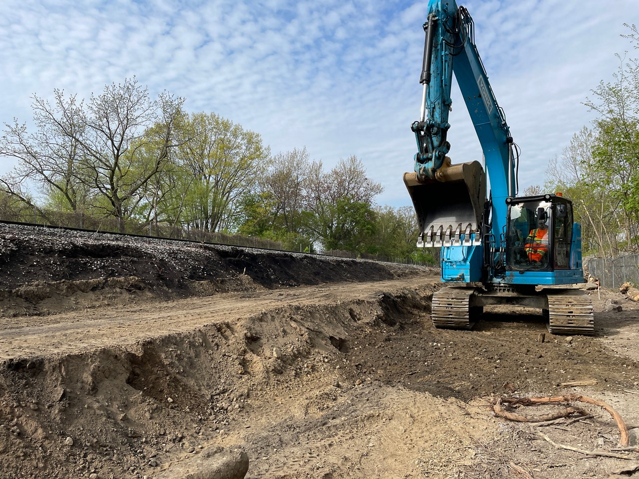 Excavator dumping the soil. 