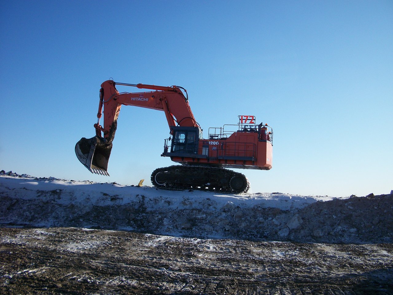 Excavator dumping the soil. 