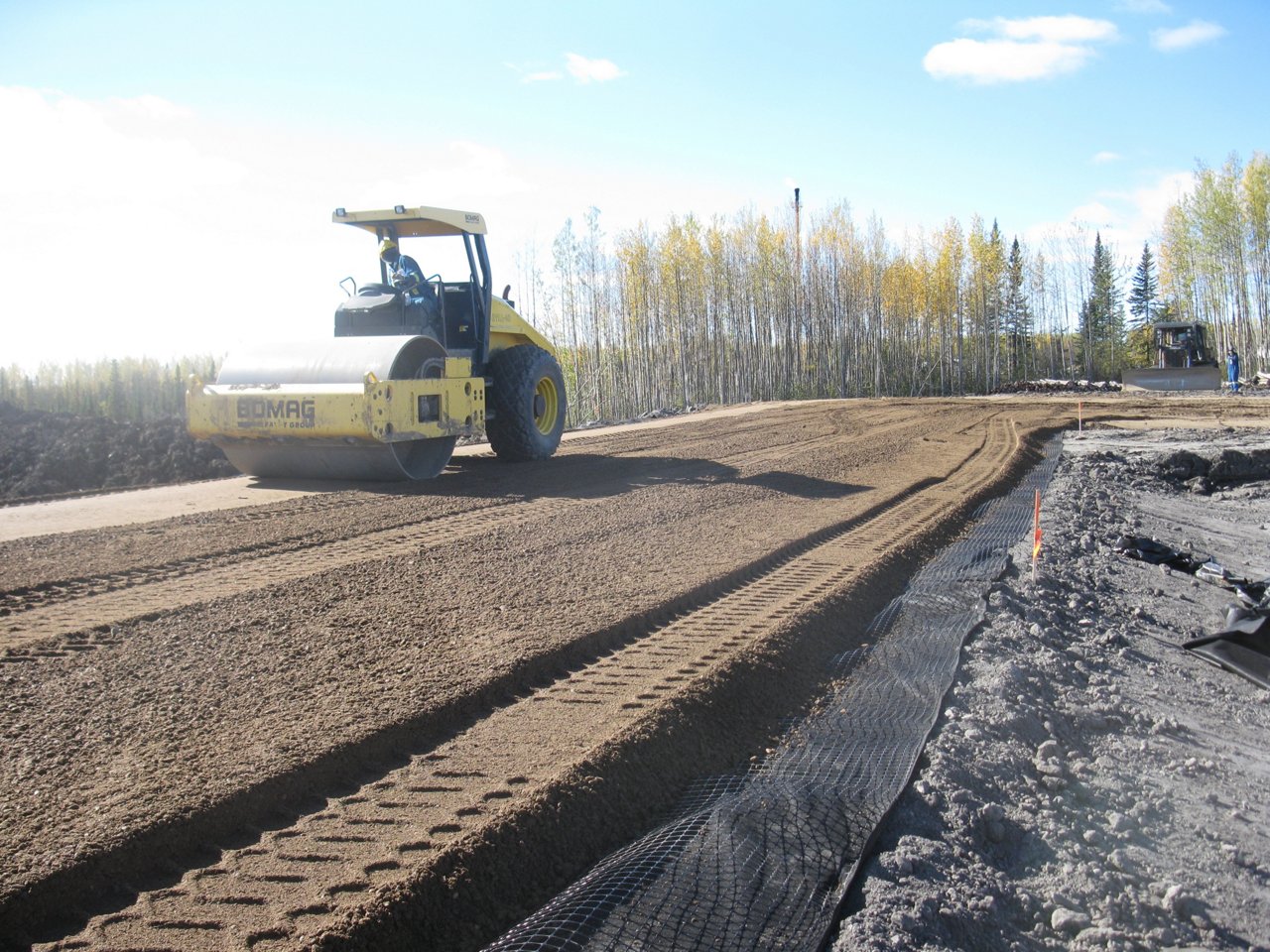 Road Roller doing rough grading and road construction.