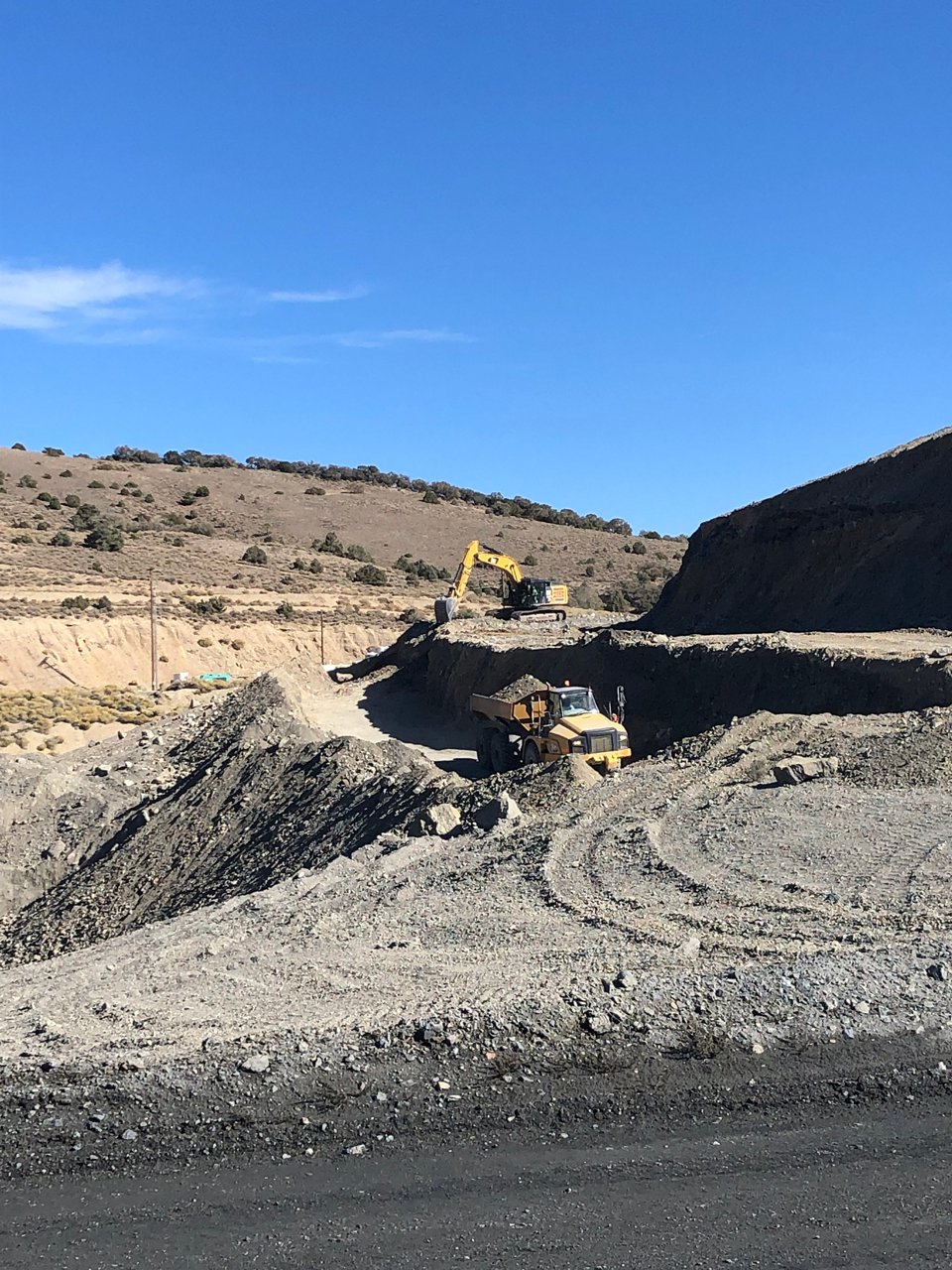 Excavator dumping the soil. 