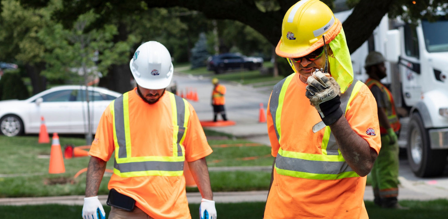 Ledcor workers installing wires.