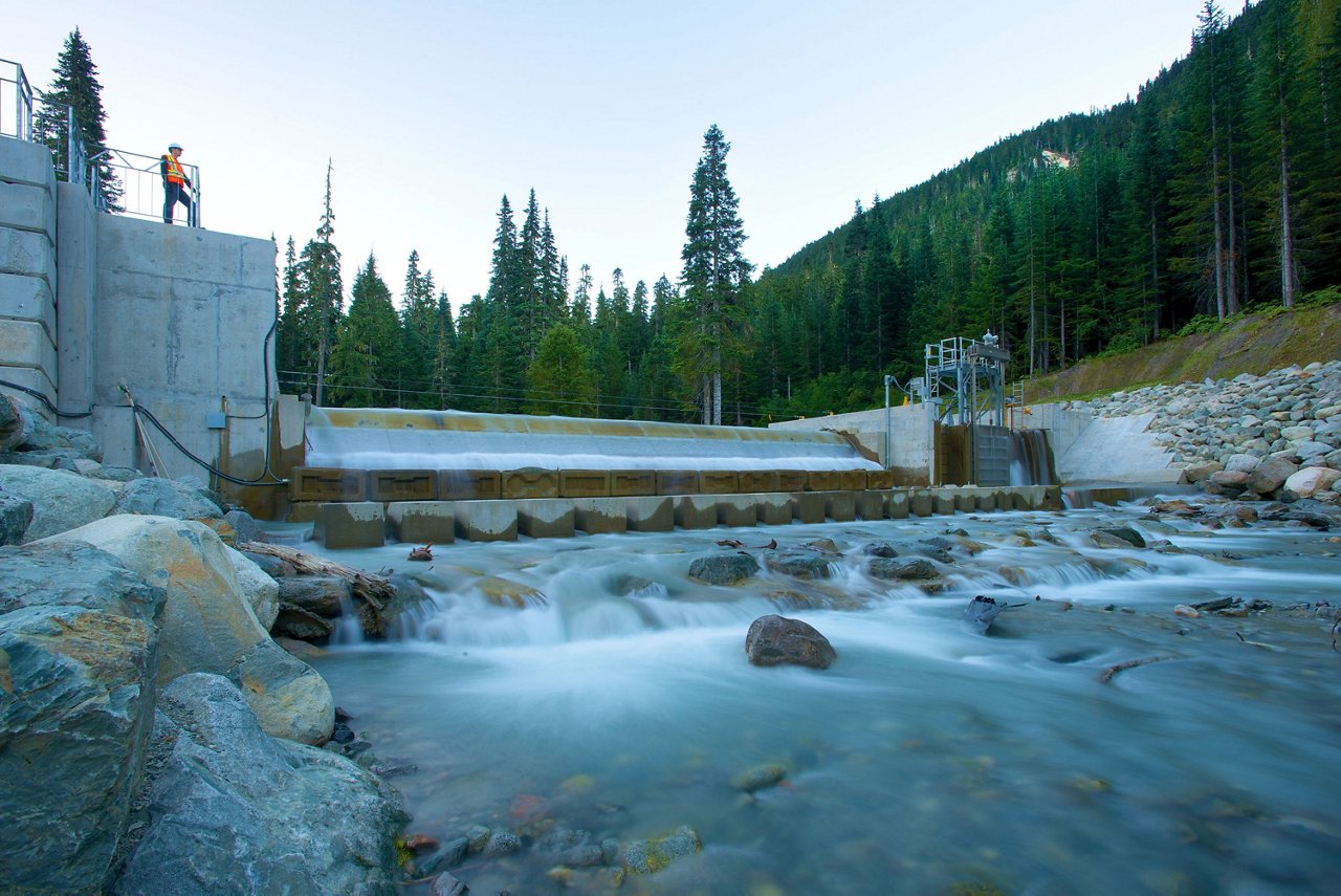 Water flowing through dam down the stream