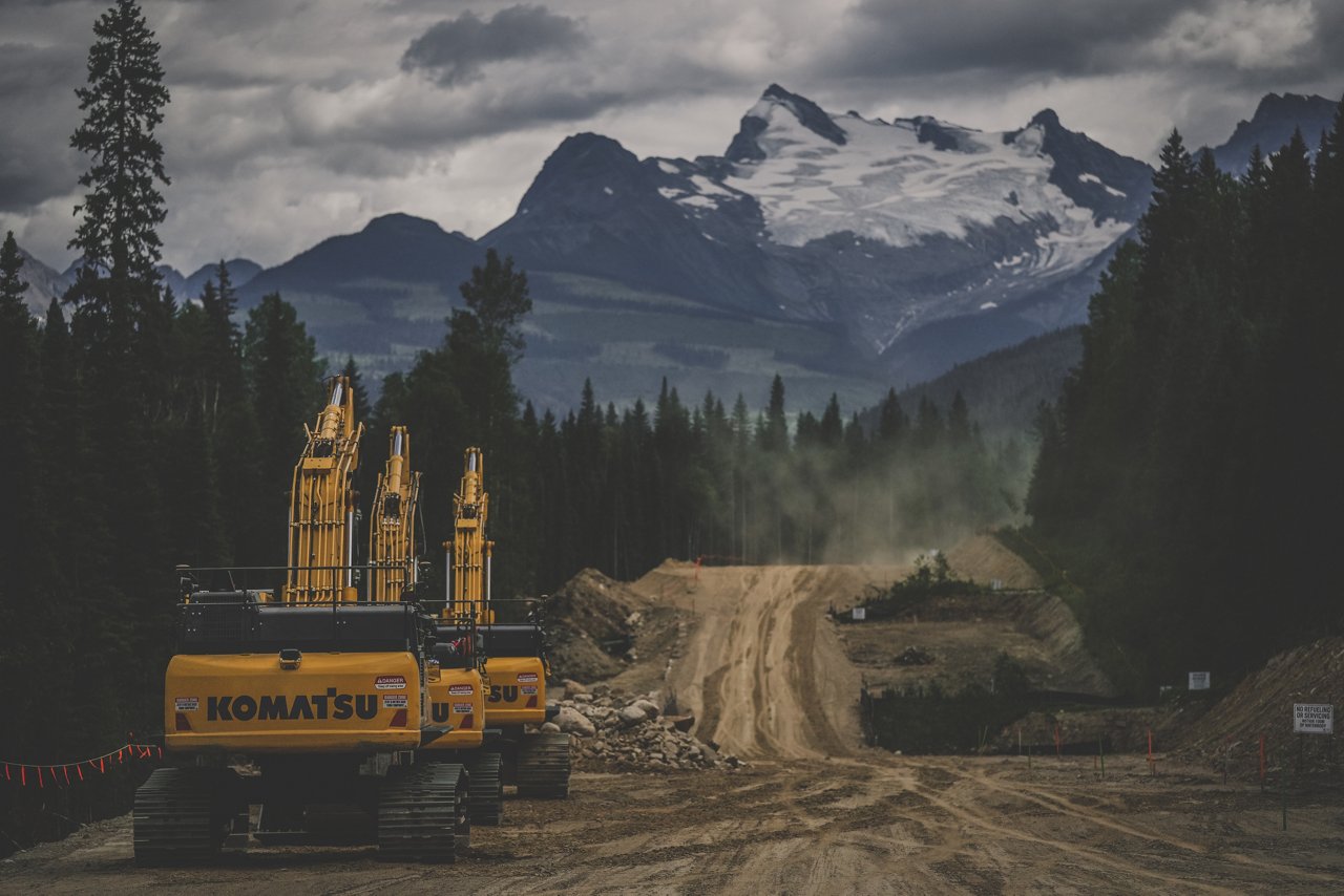 Trans Mountain Expansion Project heavy equiprment driving down dirt road