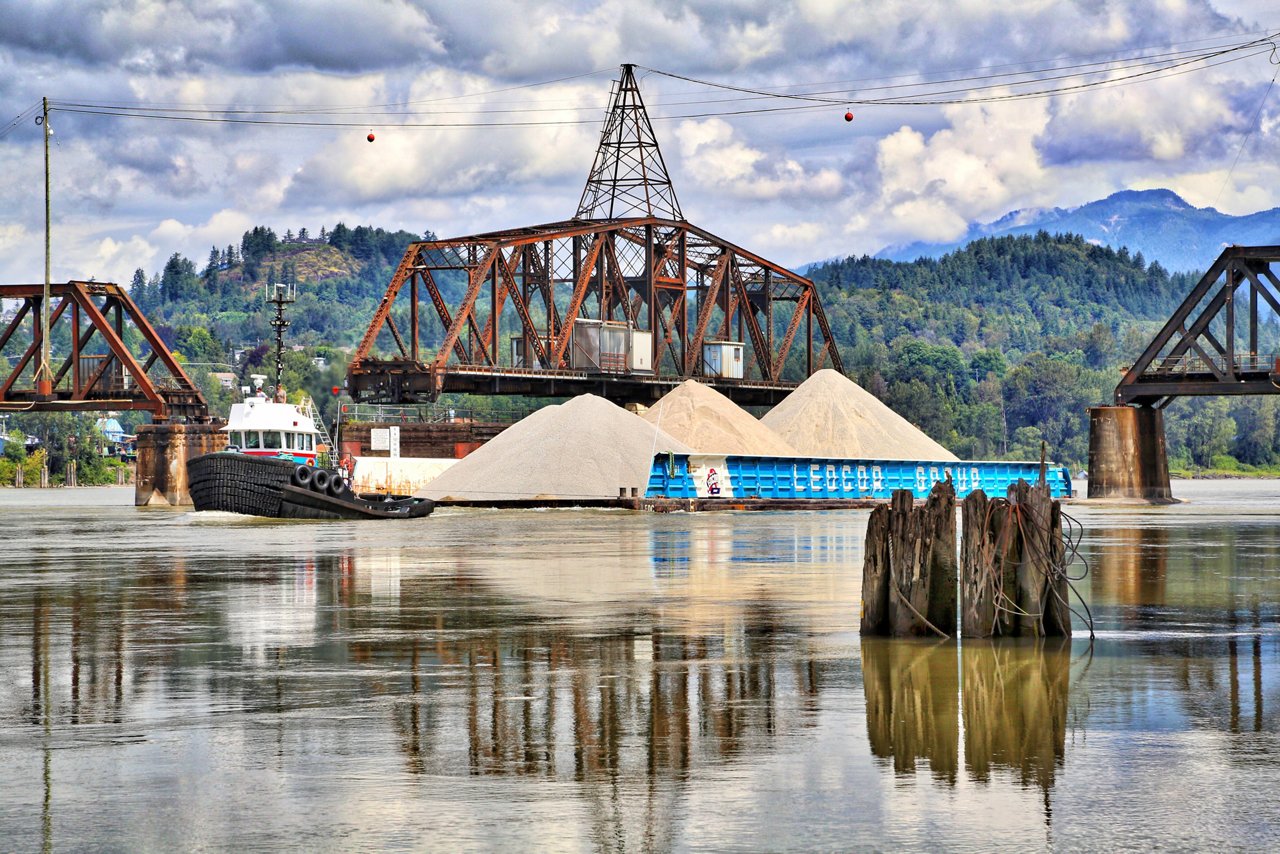 Image of Marine Summit with Tugboat and a Barge.