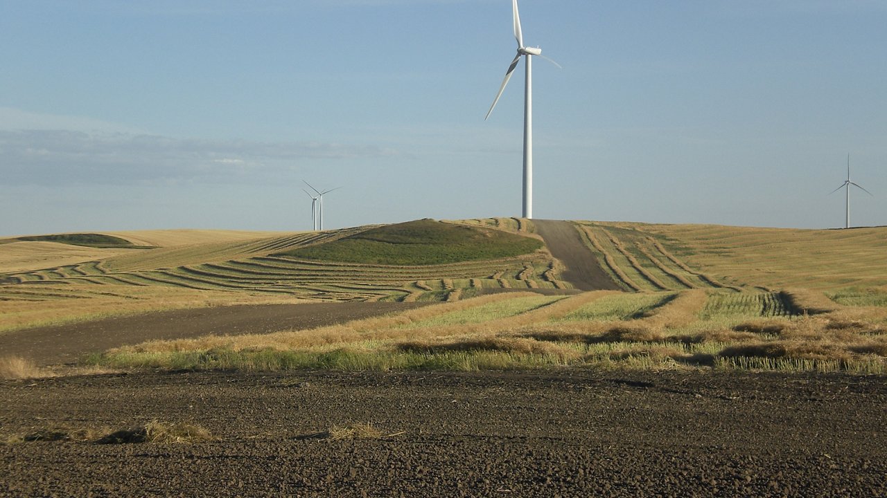 Windmill far off in field