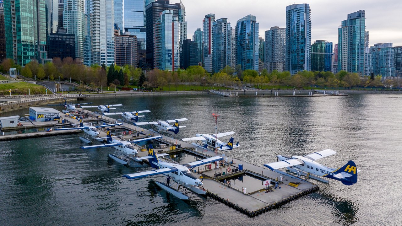 An aerial drone view of seaplanes parked at the VHFC sea terminal